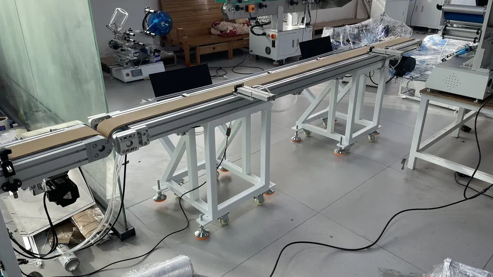 Inline Tape Applicator with Automatic Cutting and Discharge — Discharge conveyors