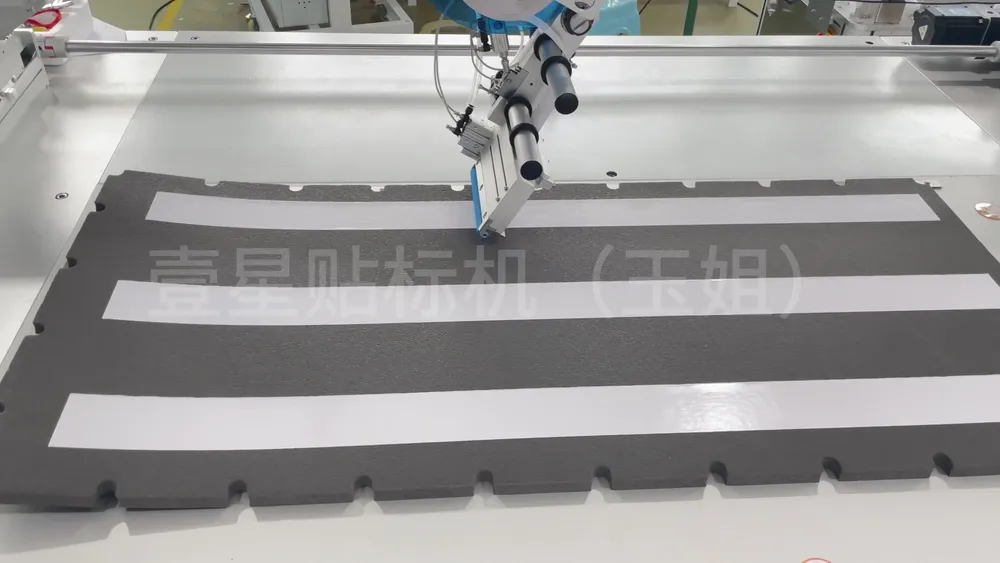 Floor-Standing 3-Axis Tape Applicator — Similar configuration — factory demo still