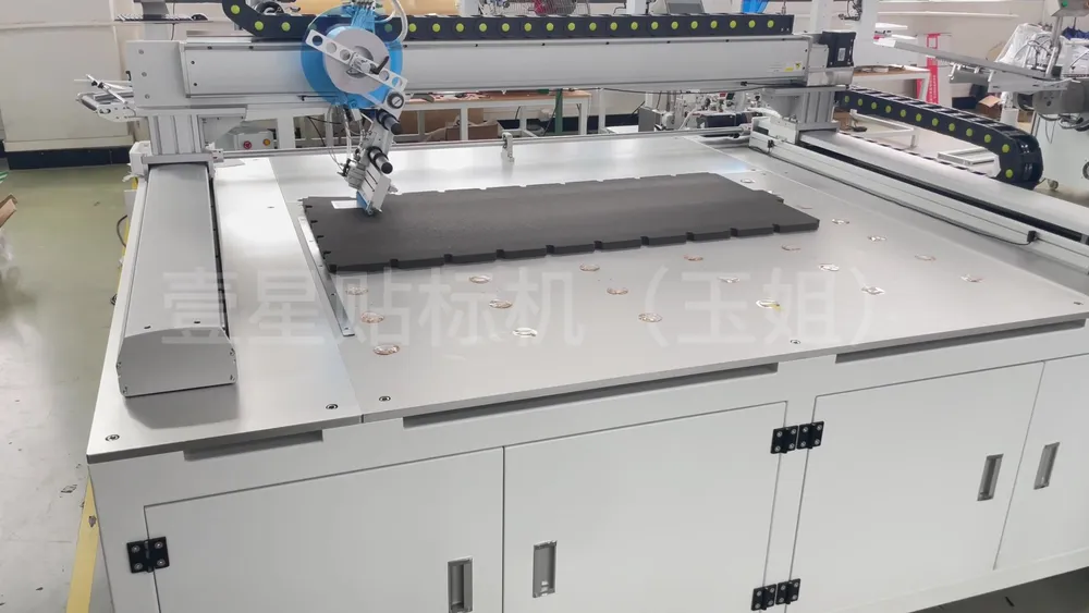 Floor-Standing 3-Axis Tape Applicator — Similar configuration — factory demo still