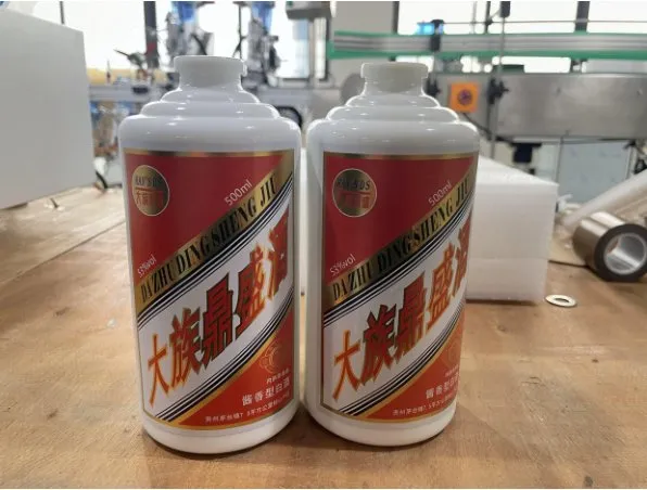 Semi-Automatic Round Bottle Labeling Machine — Liquor bottles with wrap-around labels