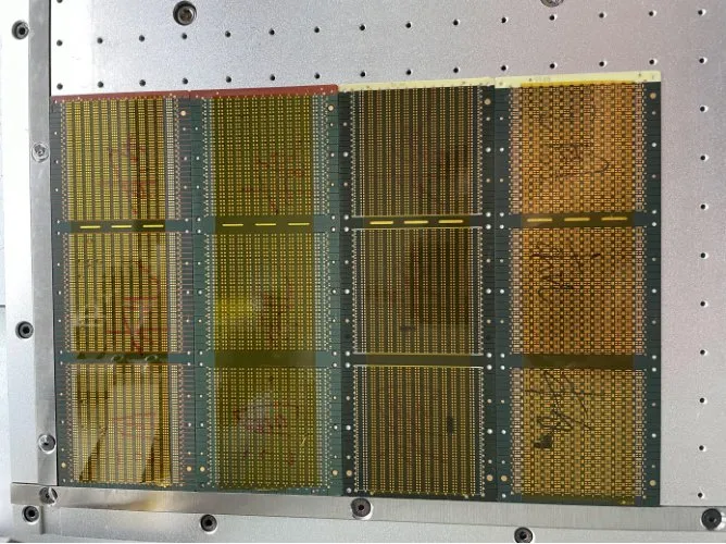 Desktop Tape Applicator — Yellow high-temperature tape applied on PCB panels