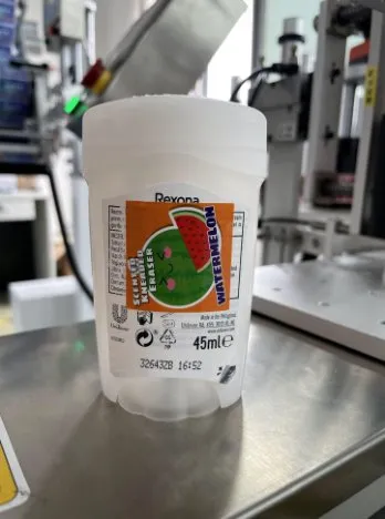 Semi-Automatic Double-Side Labeling Machine — Plastic tub labeled on two sides (side 1)