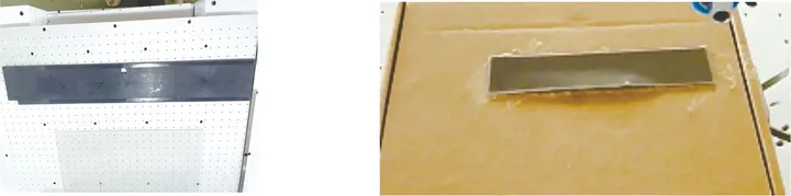 Floor-Standing Rotary-Platform Tape Applicator with Liner Peeling — Taping samples: a strip part on the vacuum table and a cardboard part