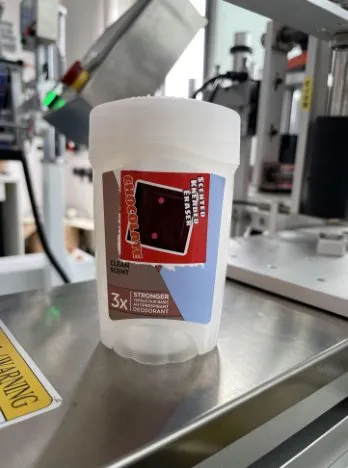Semi-Automatic Double-Side Labeling Machine — Plastic tub labeled on two sides (side 2)