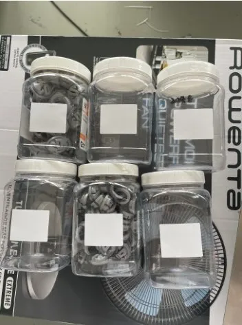 Automatic Bottom-Surface Labeling Machine — Clear jars labeled on the bottom