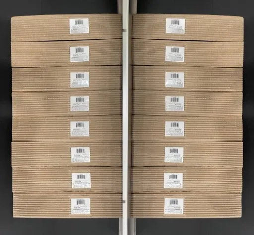Card-Dispensing Print-and-Apply Labeling Machine with Buffer — Paper cards with printed labels, stacked after labeling