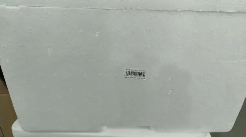 Side Print-and-Apply Labeling Machine — Foam box with a barcode label on the side
