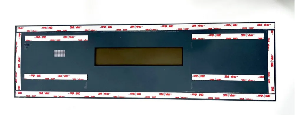 Floor-Standing Rotary-Head Tape Applicator — Panel with 3M double-sided tape applied around the edges and across the middle