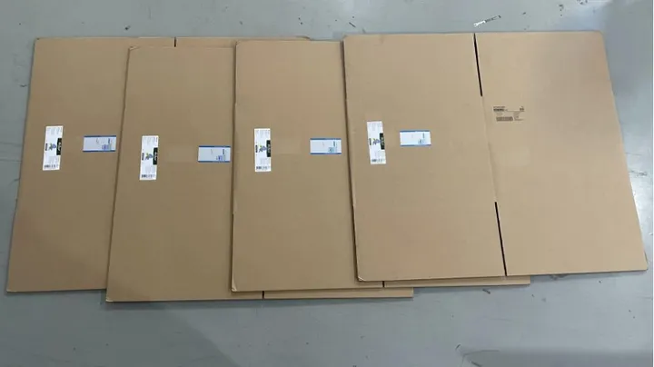 Automatic Flat Carton Labeling Machine — Flat kraft carton blanks with labels