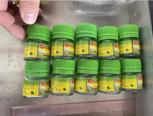 Automatic Roll-Rubbing Wrap-Around Labeling Machine — Small round jars with labels