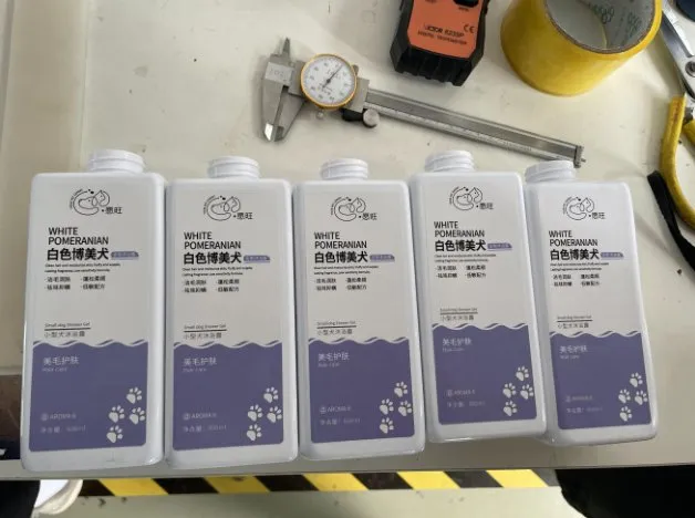 Semi-Automatic Double-Side Labeling Machine — Flat bottles labeled on both sides (side 2)